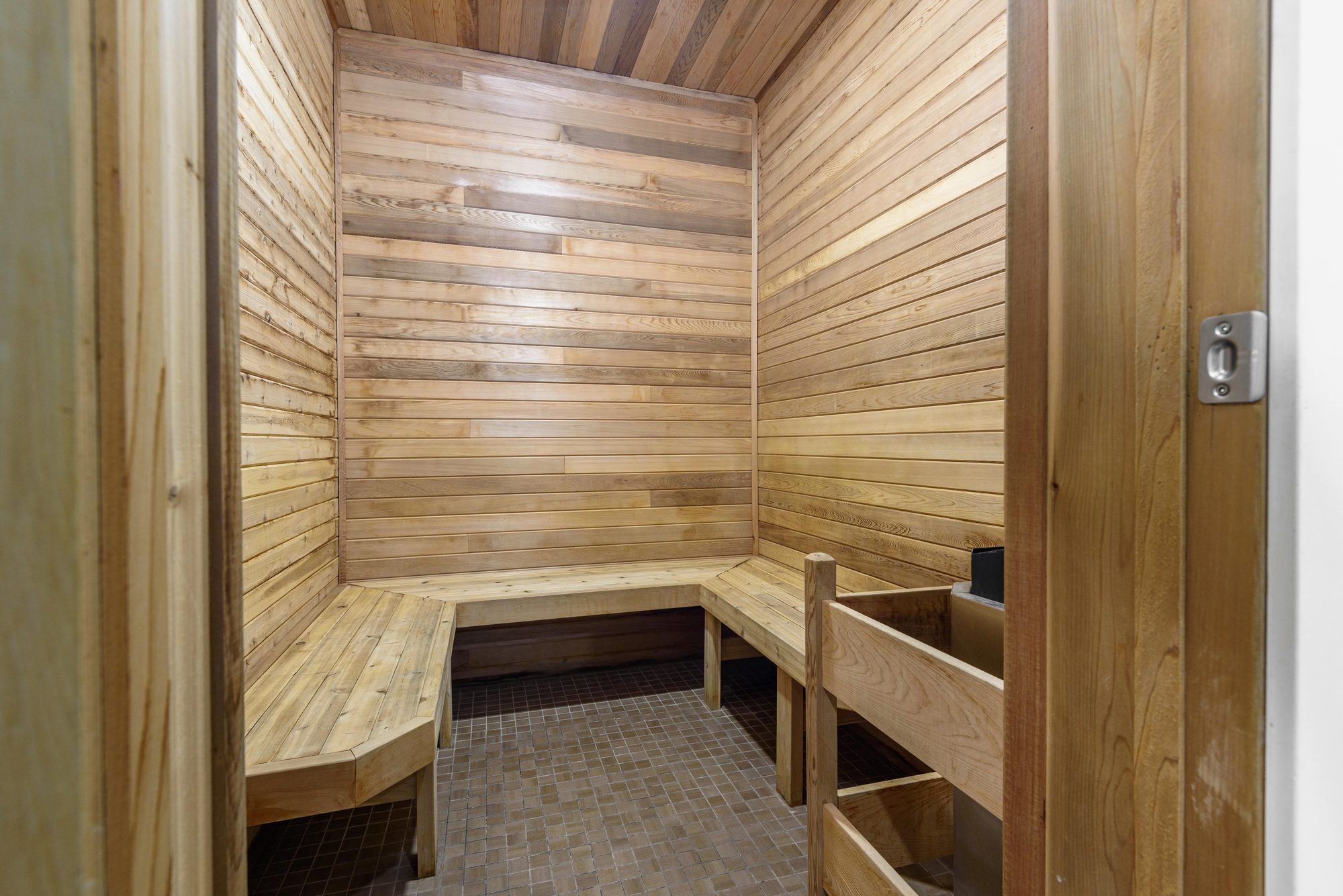 Cedar-lined dry sauna with tiered bench seating