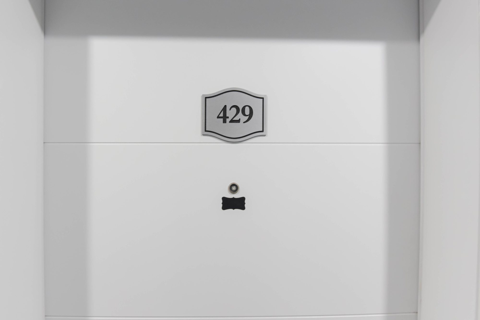 Entry door of a studio suite at The Metro 1827