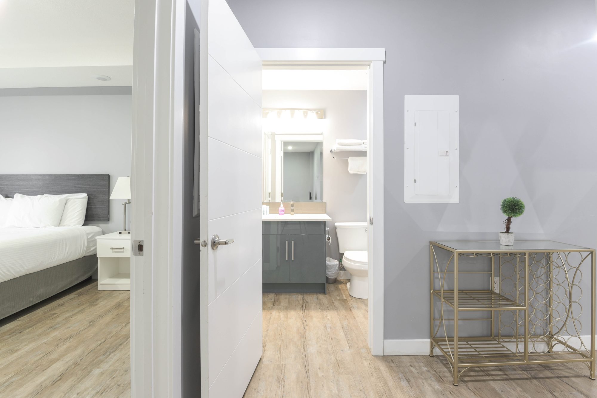 View from a bedroom past the bathroom toward the dining nook